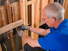 plumbing contractor in Bellevue WA reroutes a bathtub water line